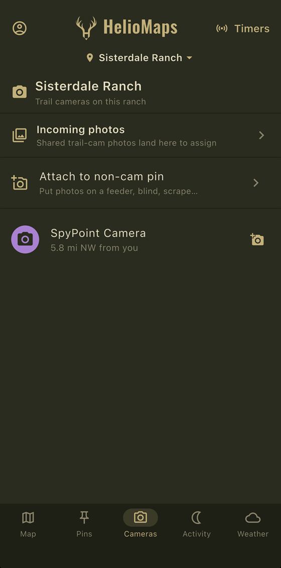 HelioMaps cameras screen listing trail cameras on a ranch, incoming photos waiting to be assigned, and a connected trail camera