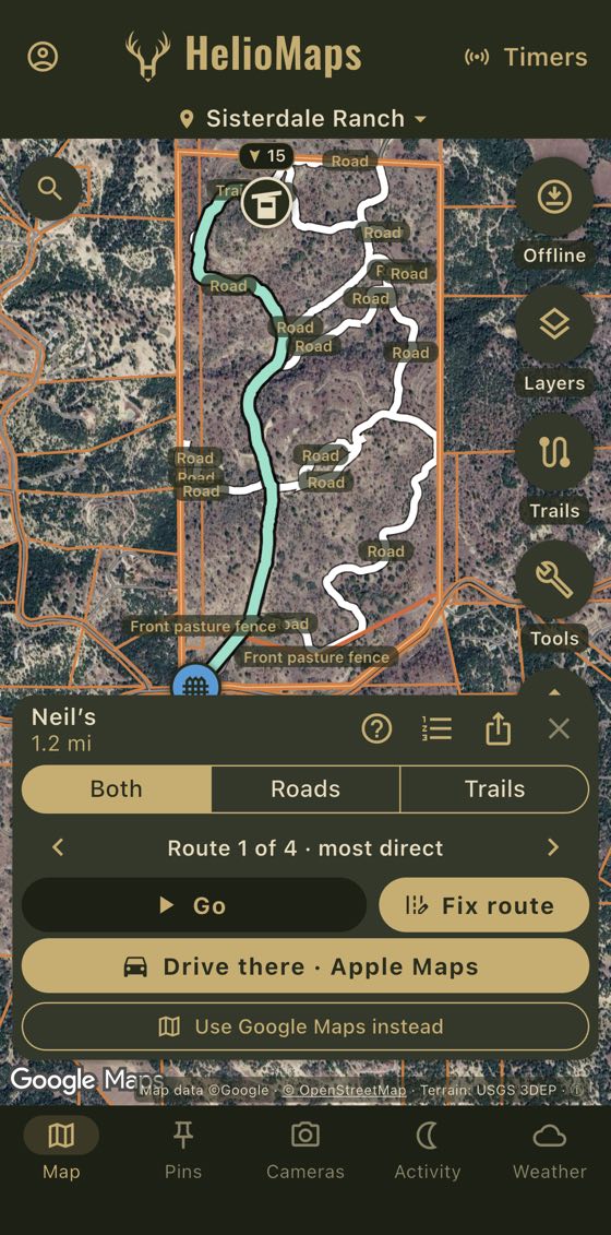 A ranch map over satellite imagery with the route drawn in green from a gate at the bottom, along the ranch's roads and a trail, to the blind at the top. The sheet below shows Neil’s, 1.2 mi, Both, Roads and Trails, Go, Fix route and Drive there.